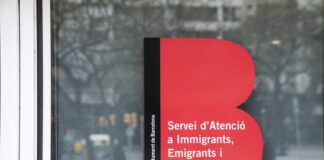 Cartel del Servicio de Atención a Inmigrantes, Emigrantes y Refugiados (SAIER) de Barcelona.