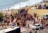 Personas saltando la valla en Ceuta.